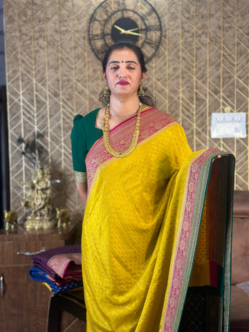 Yellow and pink green pure crepe Banaras silk sarees.