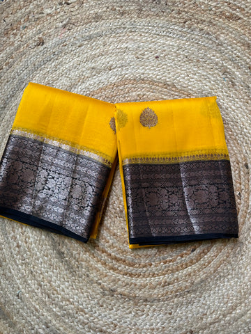 Yellow and black pure kora organza silk sarees.