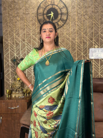 Green semi crepe kalamkari saree.