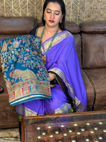 Peacock green pure moonga crepe saree.