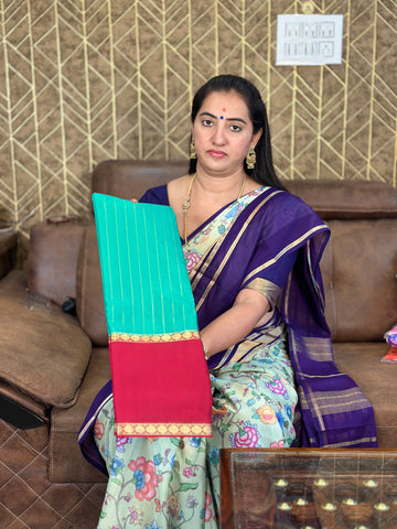 Rama green with red wrinkle Mysore Silk crepe, vertical stripes all over the body.