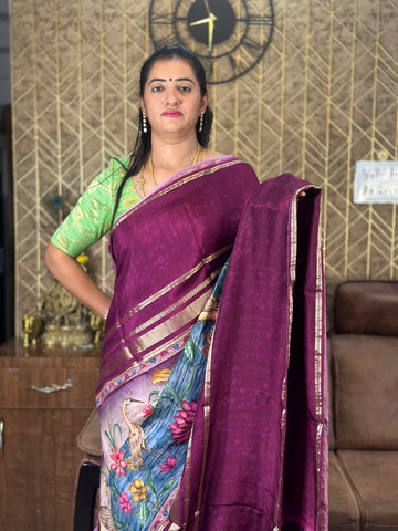 Wine semi crepe kalamkari saree.