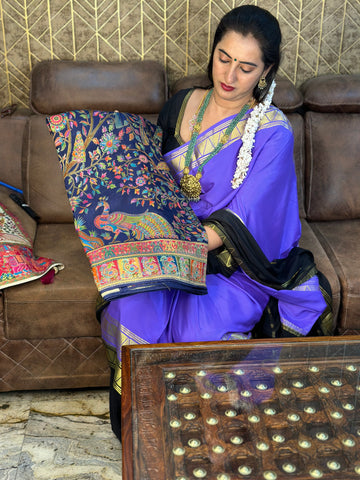 Navy blue pure moonga crepe saree with Kashmiri work all over the body.