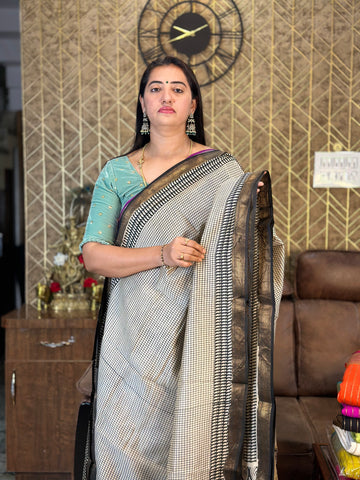 Maheshwari silk sarees. Small checks all over the body.
