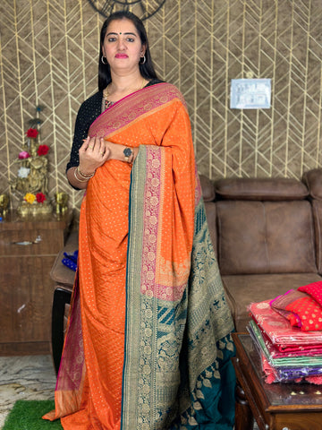 Orange with pink and peacock green combination pure crepe Banaras. 3D