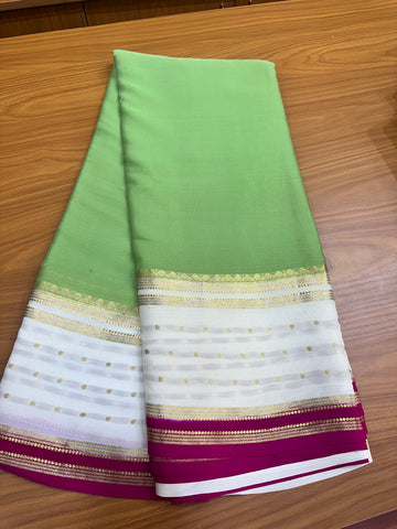 Pistha green with white border butta pure crepe 120 gsm