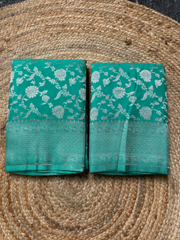 Sea green soft georgette in jaal pattern.