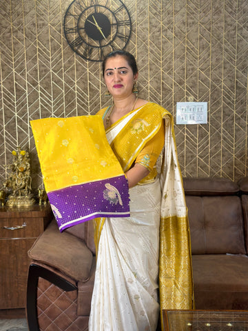 Yellow and mejentha dola silk with checks border.