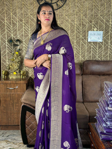 Purple viscose georgette with mango motives.