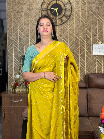 Mustard pure chinnon crepe sarees.