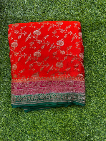 Pure crape Banaras,jaal pattern orange with green.