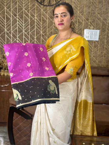 Black and pink dola silk saree with checks border.