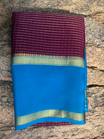 Mejentha with sky blue, Mysore Silk crepe checks with bentex border. 70 grams thickness.