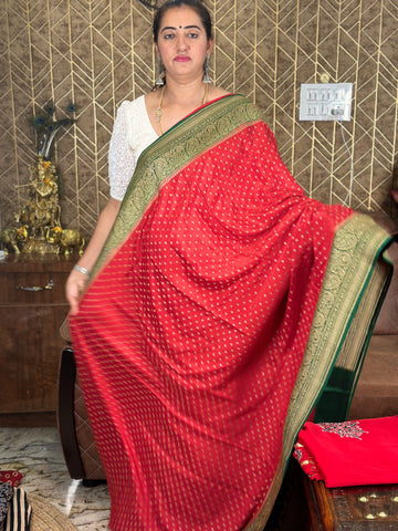Red and green pure crepe Banaras silk sarees.