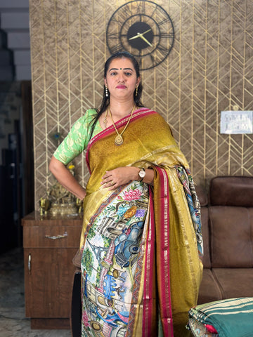 Mustard with red semi crepe kalamkari saree.
