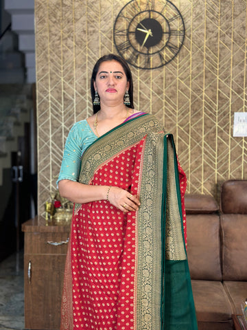 Red with green pure khaddi Georgette sarees.