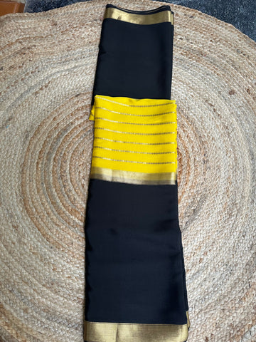 Yellow and black pure Mysore Silk crepe 100 gsm centre line pattern.