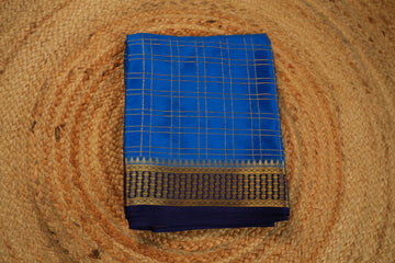 Sky blue with navy blue Pure Mysore silk 120 gsm checks pattern.
