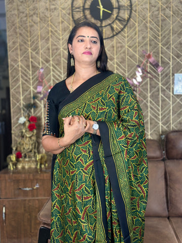 Green pure modal silk saree. Ajrak prints.