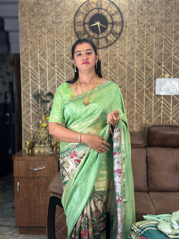 Pistha green semi crepe kalamkari saree.