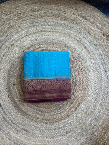 Blue and dark mejentha pure crepe Banaras sarees.