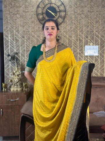 Yellow and black pure crepe Banaras handloom silk sarees with Lehariya blouse.