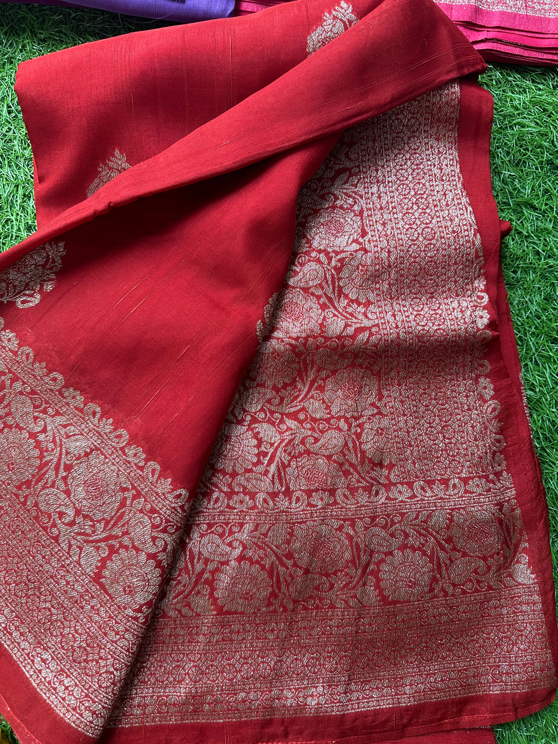 Brick red semi raw silk Banaras.