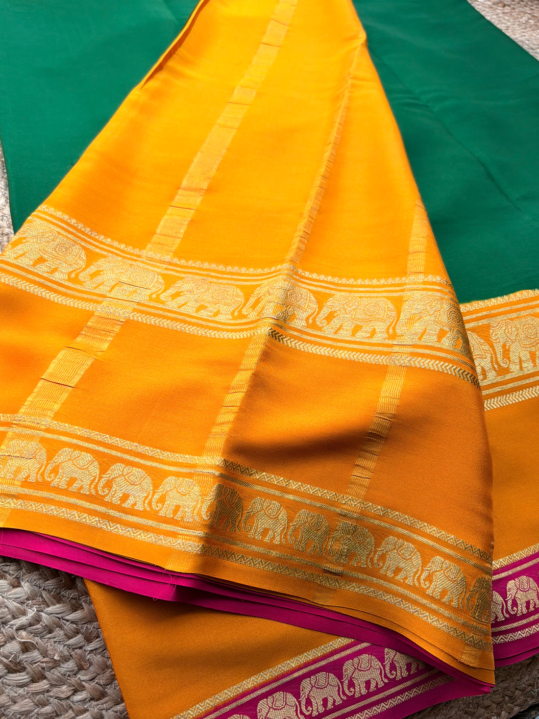 Mysuru Silk Crepe- Elephant 3 D Border (120 gsm) Green with orange and  pink border