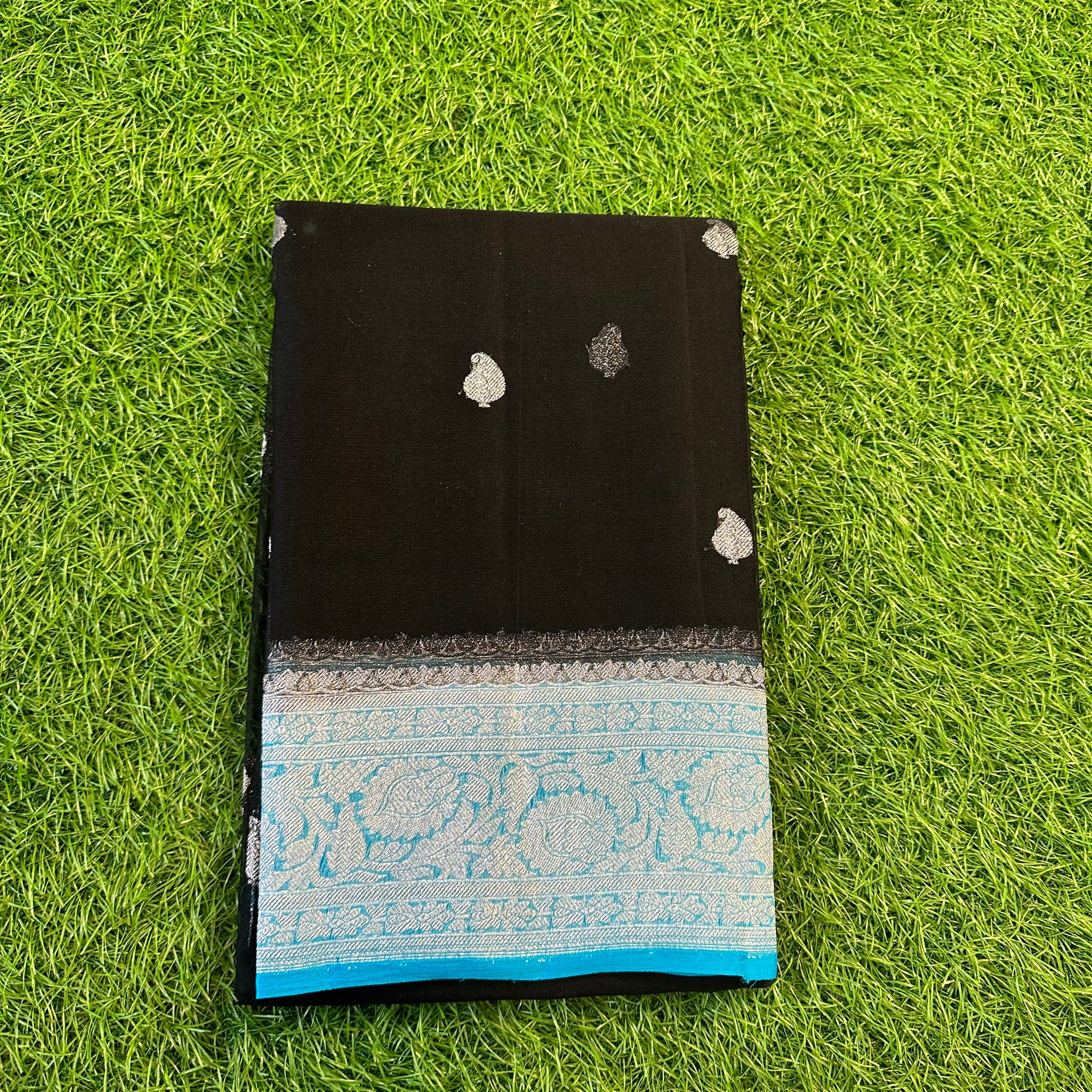 Black with sky blue pure khaddi chiffon Banarasi sarees.