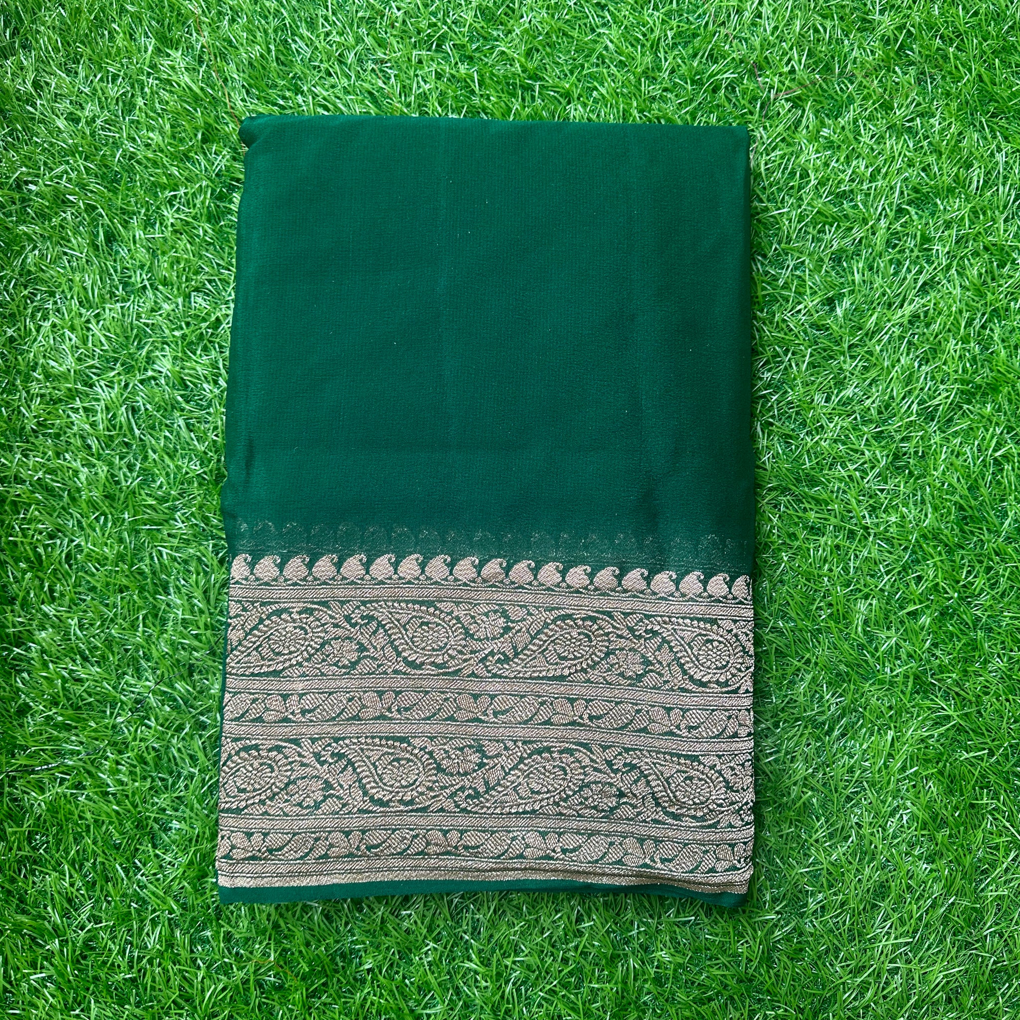 Pure Georgette Banaras. Bottle green shade, rich pallu and blouse.