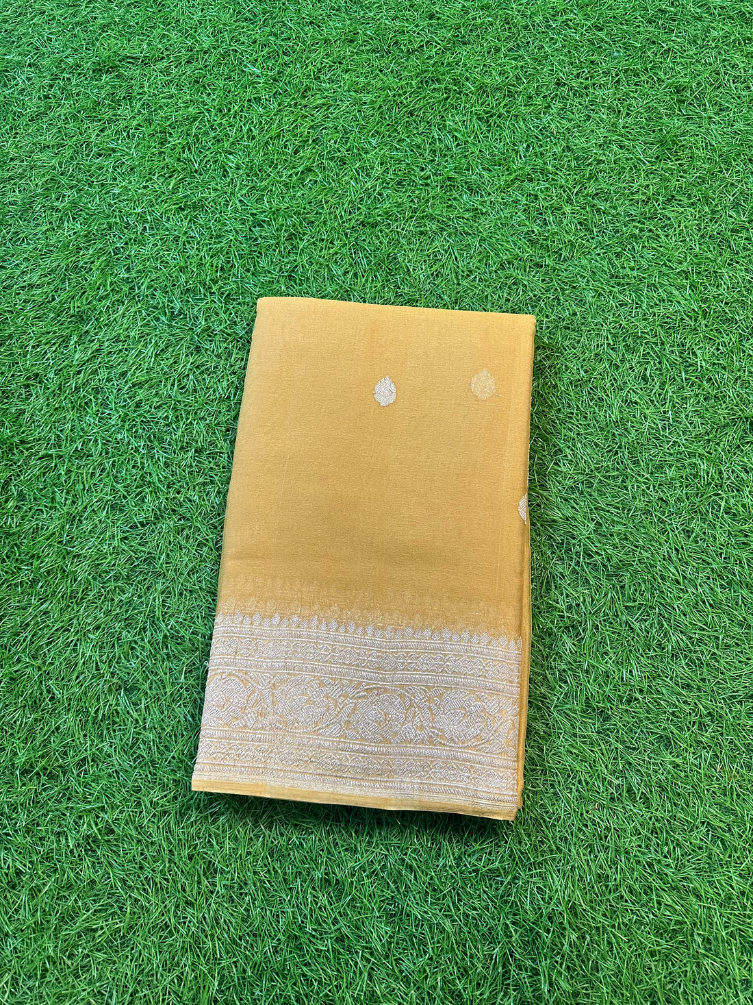 Pure Khadi chiffon in chili colour with silver zari.