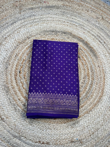 Dark purple crepe chiffon handloom saree with brocade blouse.