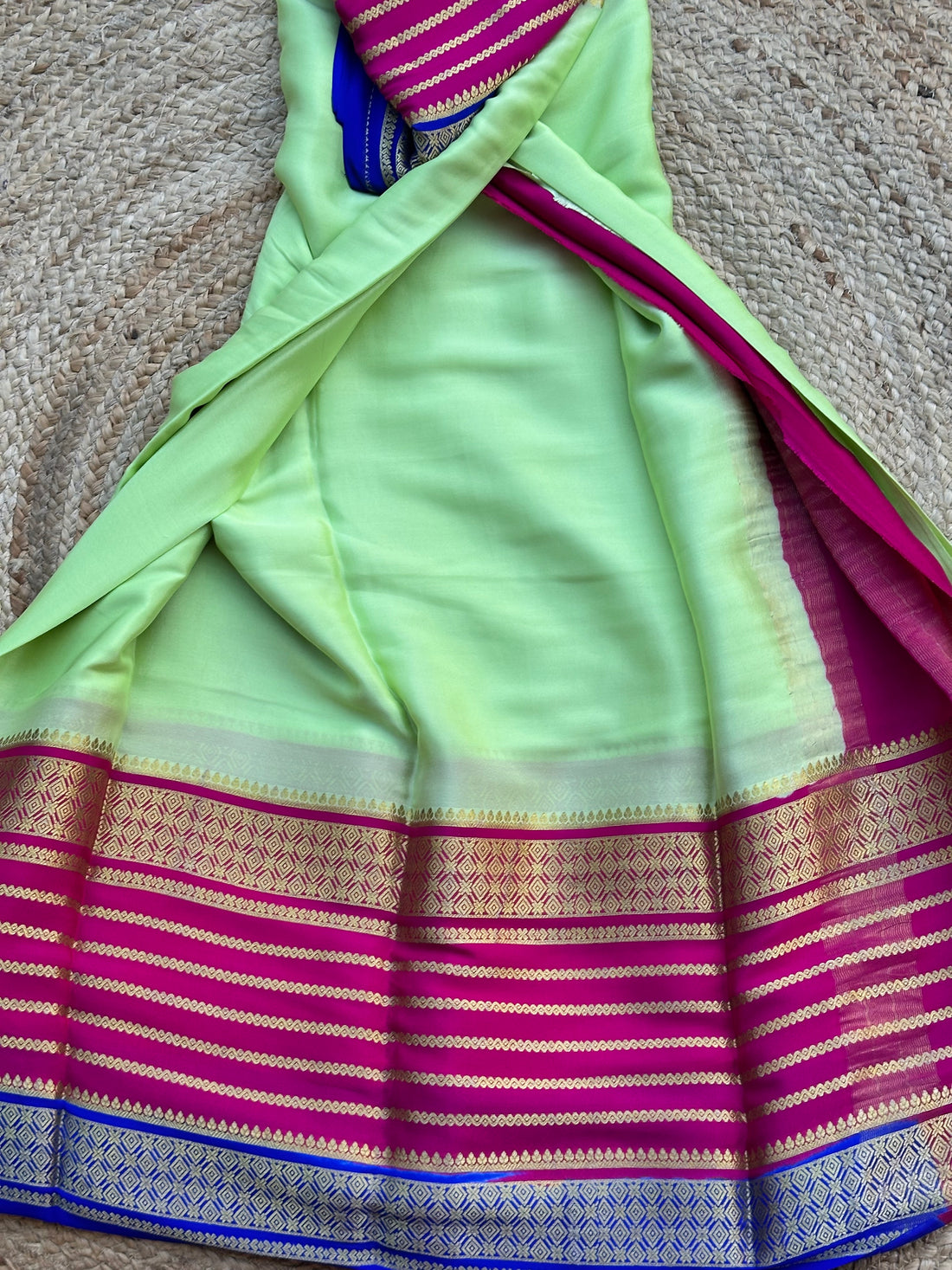 Pistha green with pink and purple Rudrakshi border crepe Mysore silk 120 gsm