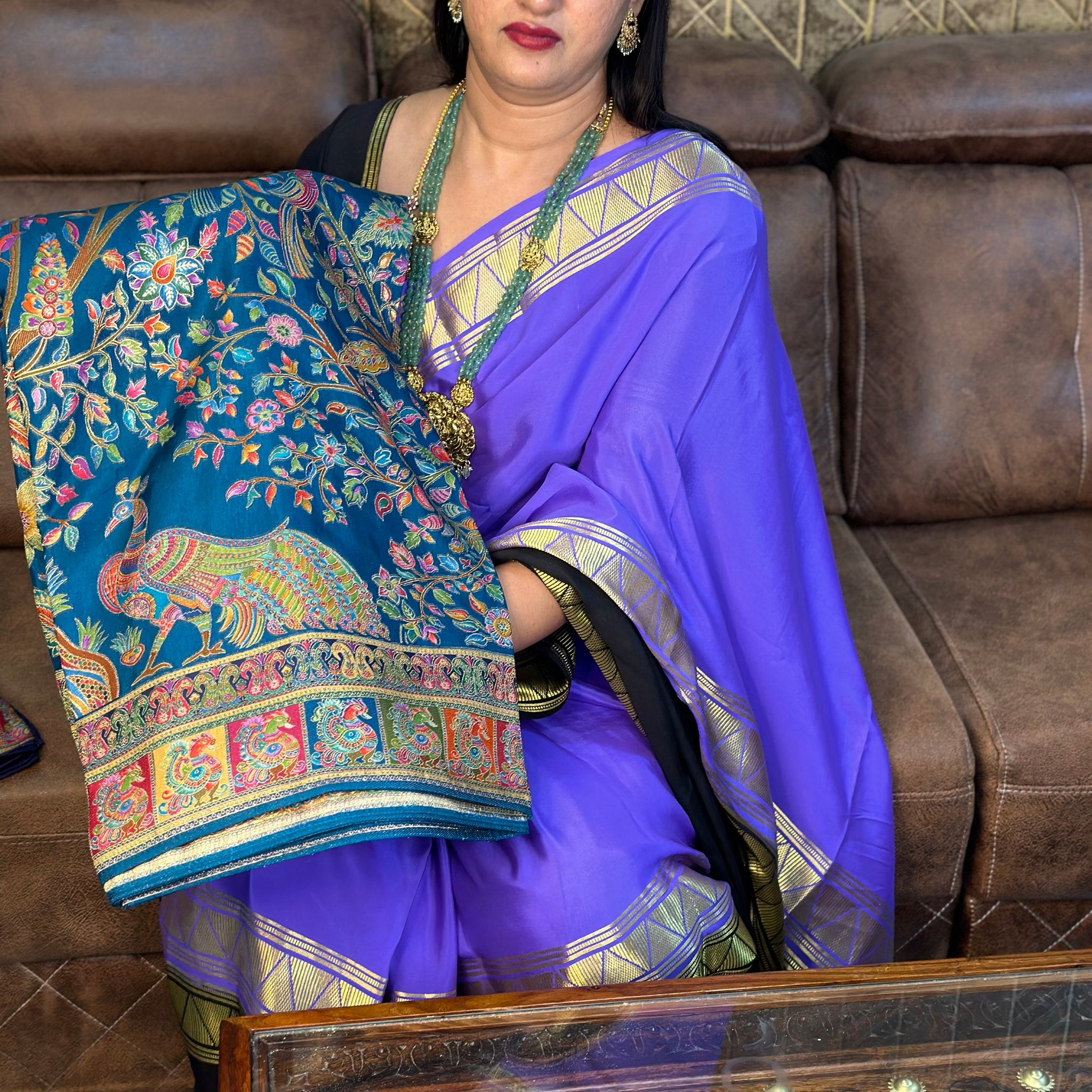 Peacock green pure moonga crepe saree.