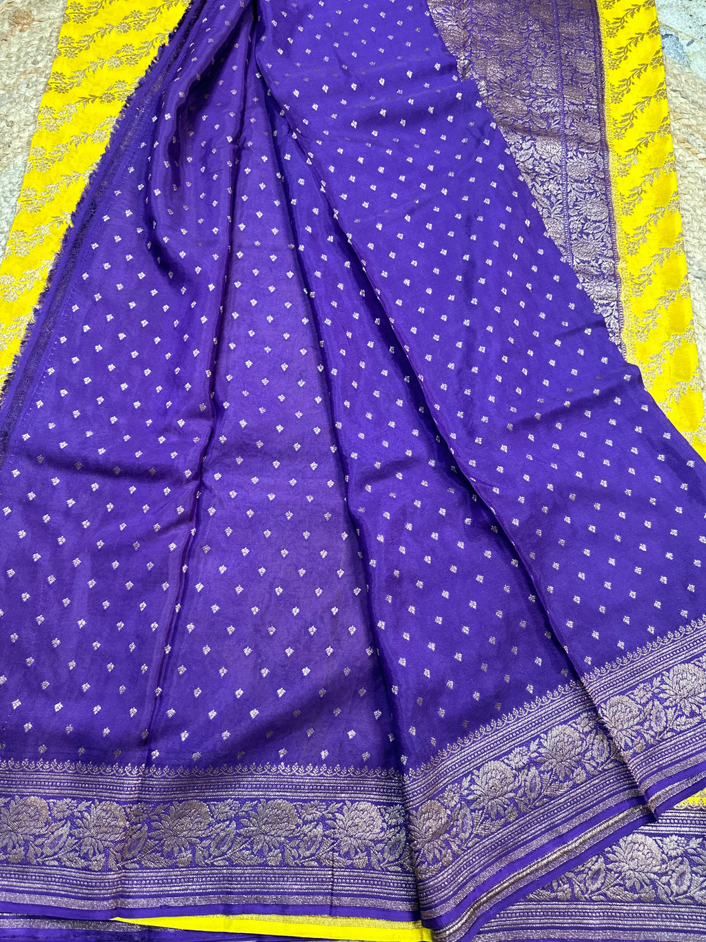 Yellow and purple crepe chiffon sarees.