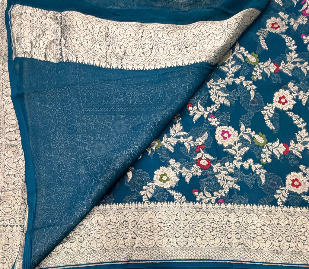 Peacock blue 2 jaal pattern pure georgette with water zari saree