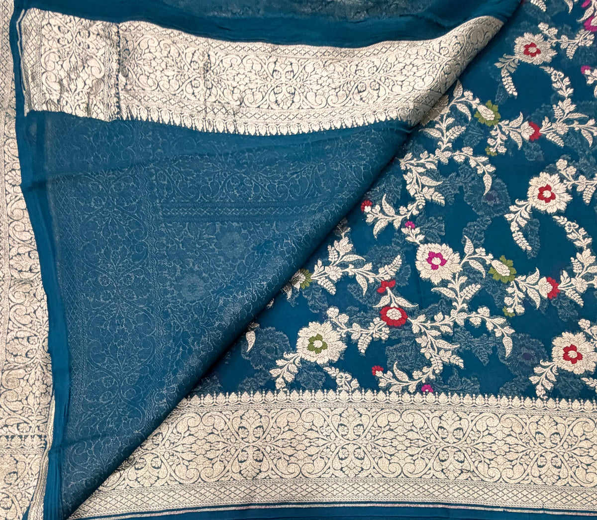 Peacock blue 2 jaal pattern pure georgette with water zari saree