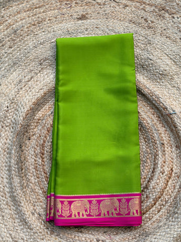Green and pink elephant border crepe Mysore silk 120gsm