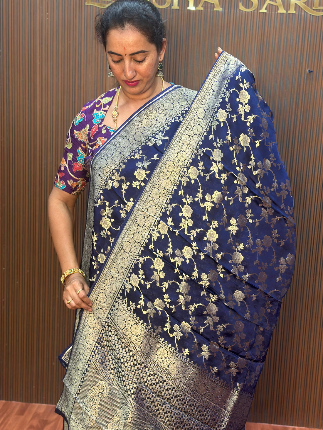 Deep blue satin organza saree.