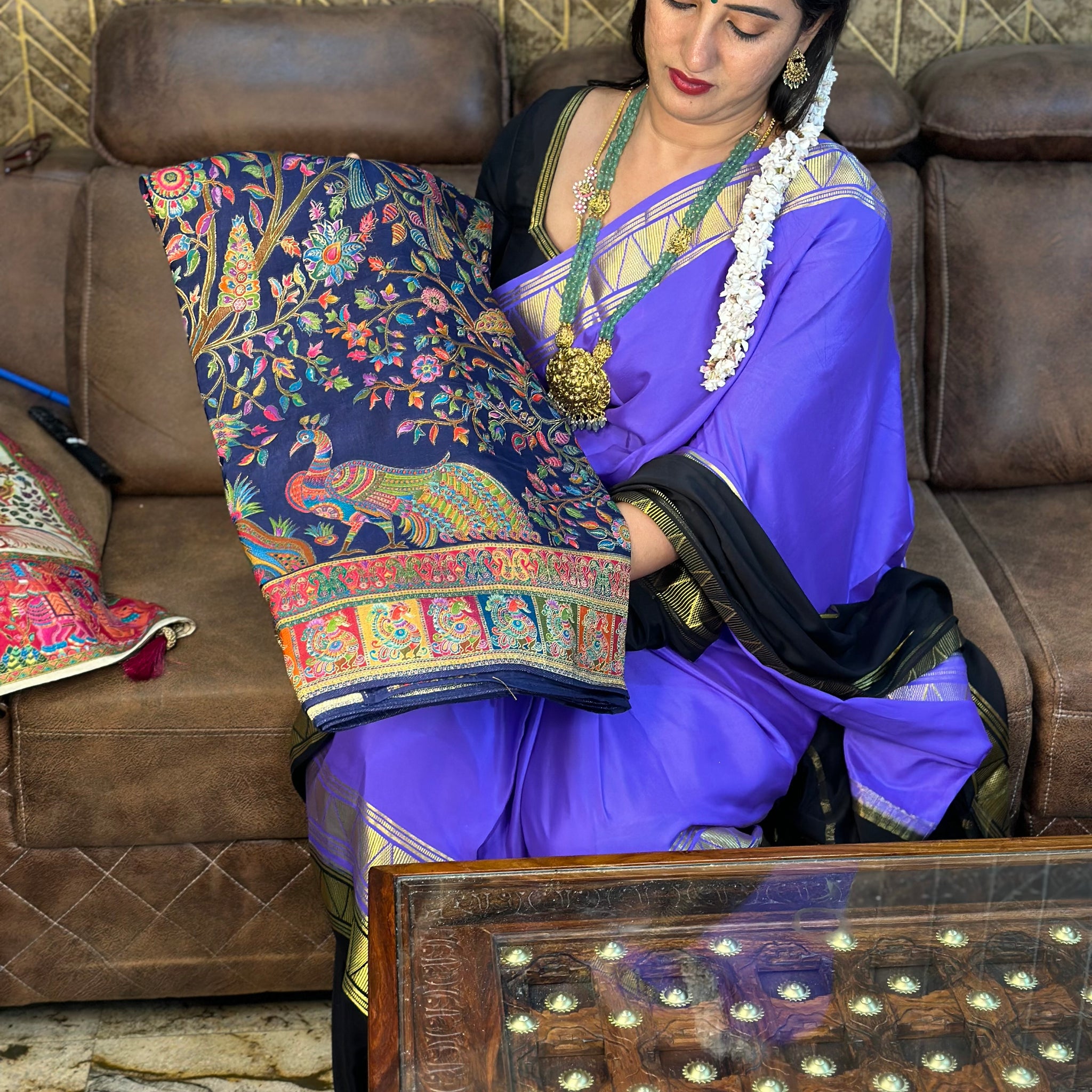 Navy blue pure moonga crepe saree with Kashmiri work all over the body.