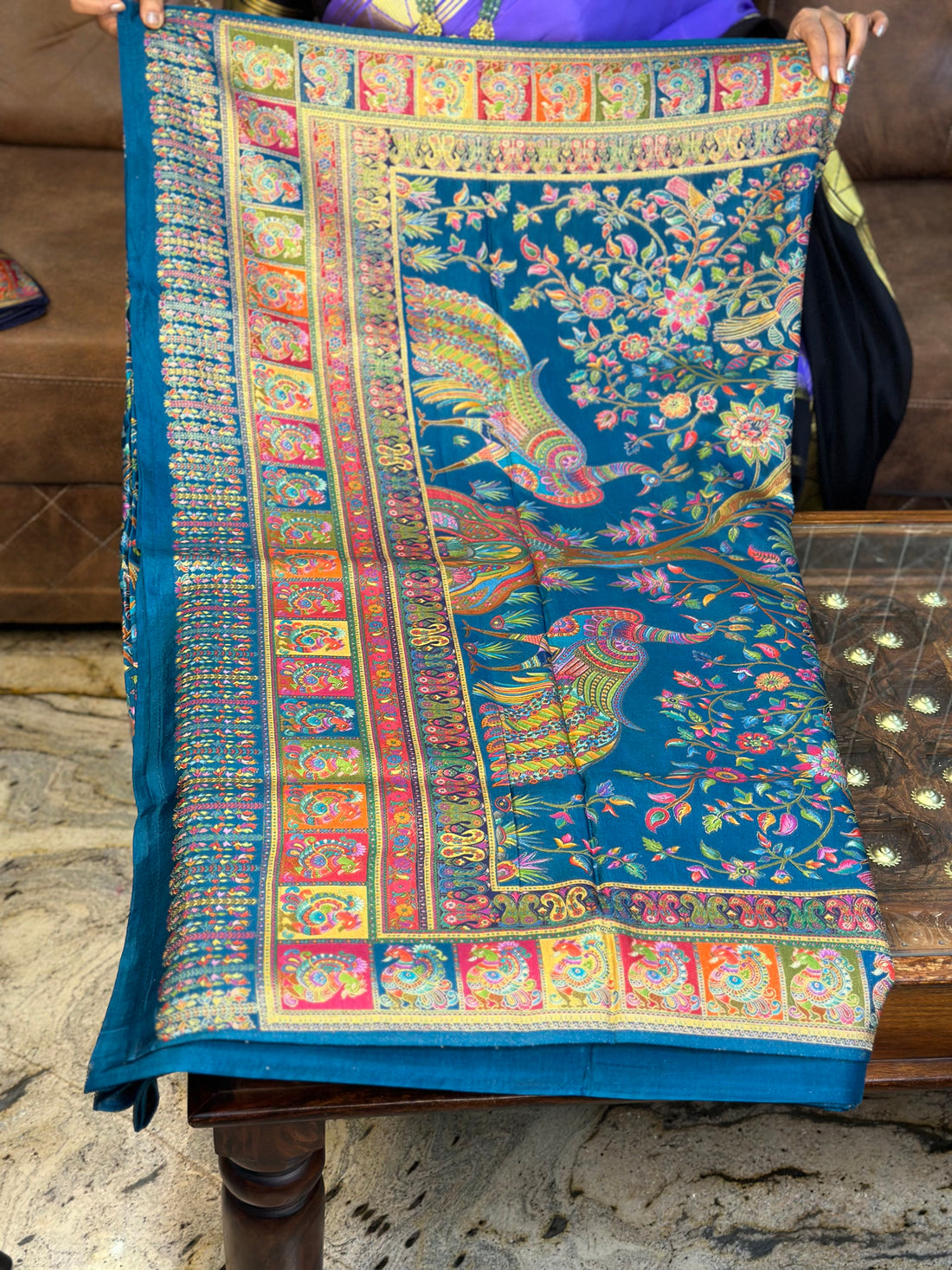 Peacock green pure moonga crepe saree.