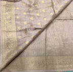 Cream Kanchi border plain modal silk saree