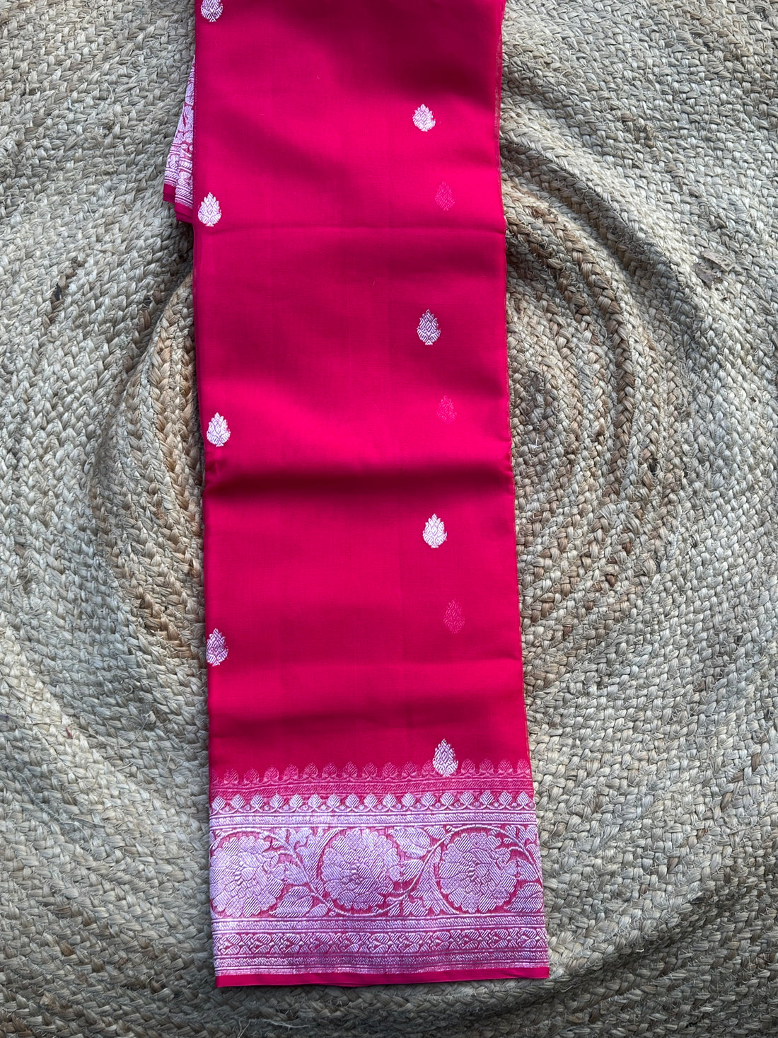 Rani pink pure khaddi chiffon silver zari woven sarees