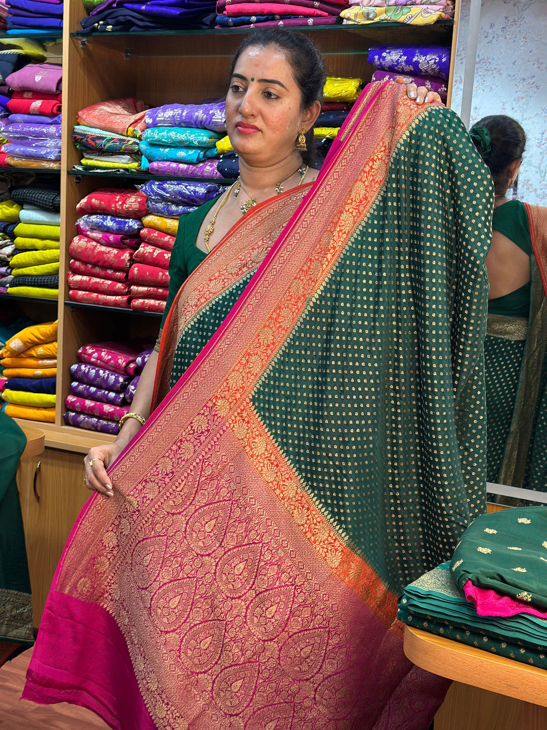 Green and orange pure crepe Banaras silk sarees.