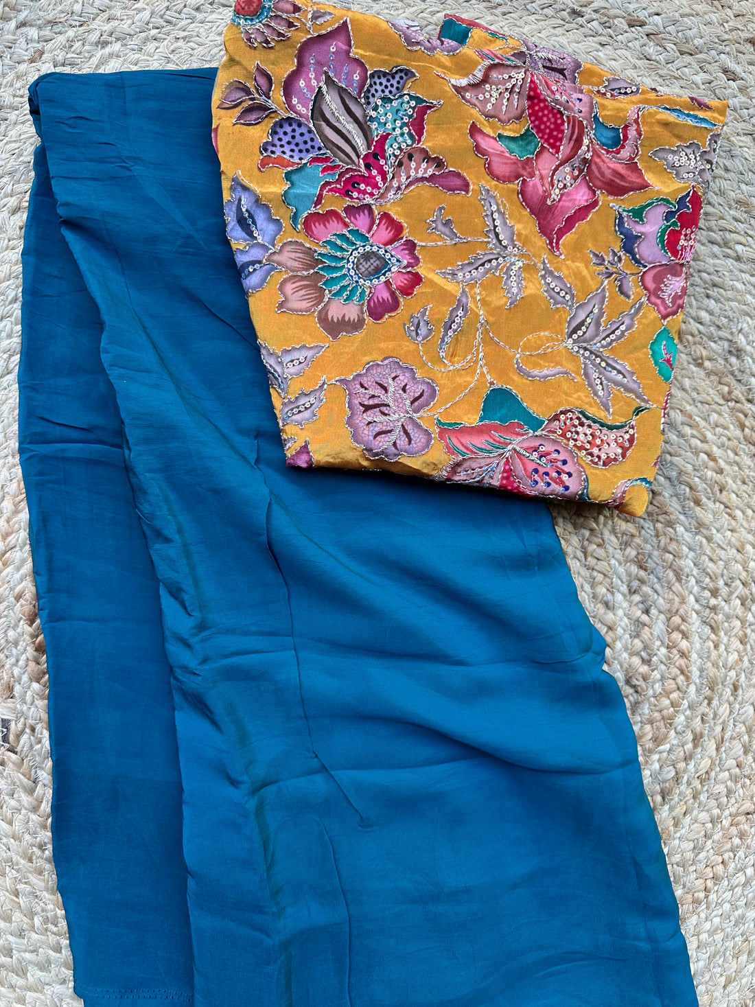 Peacock blue pure crepe sarees with brocade blouse combo