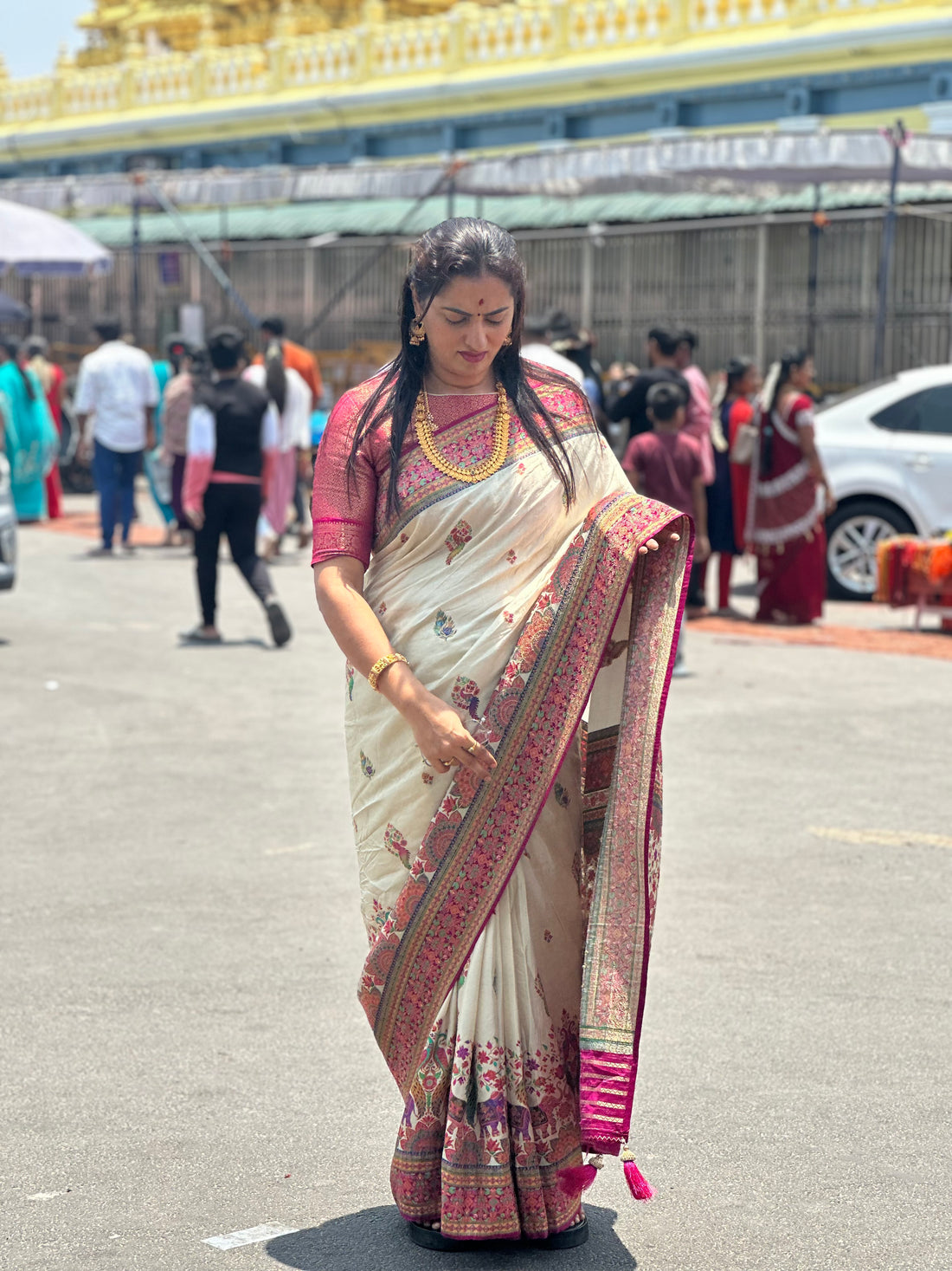 Half white pure moonga crepe with Kashmiri weaving. Pink Brocade blouse.