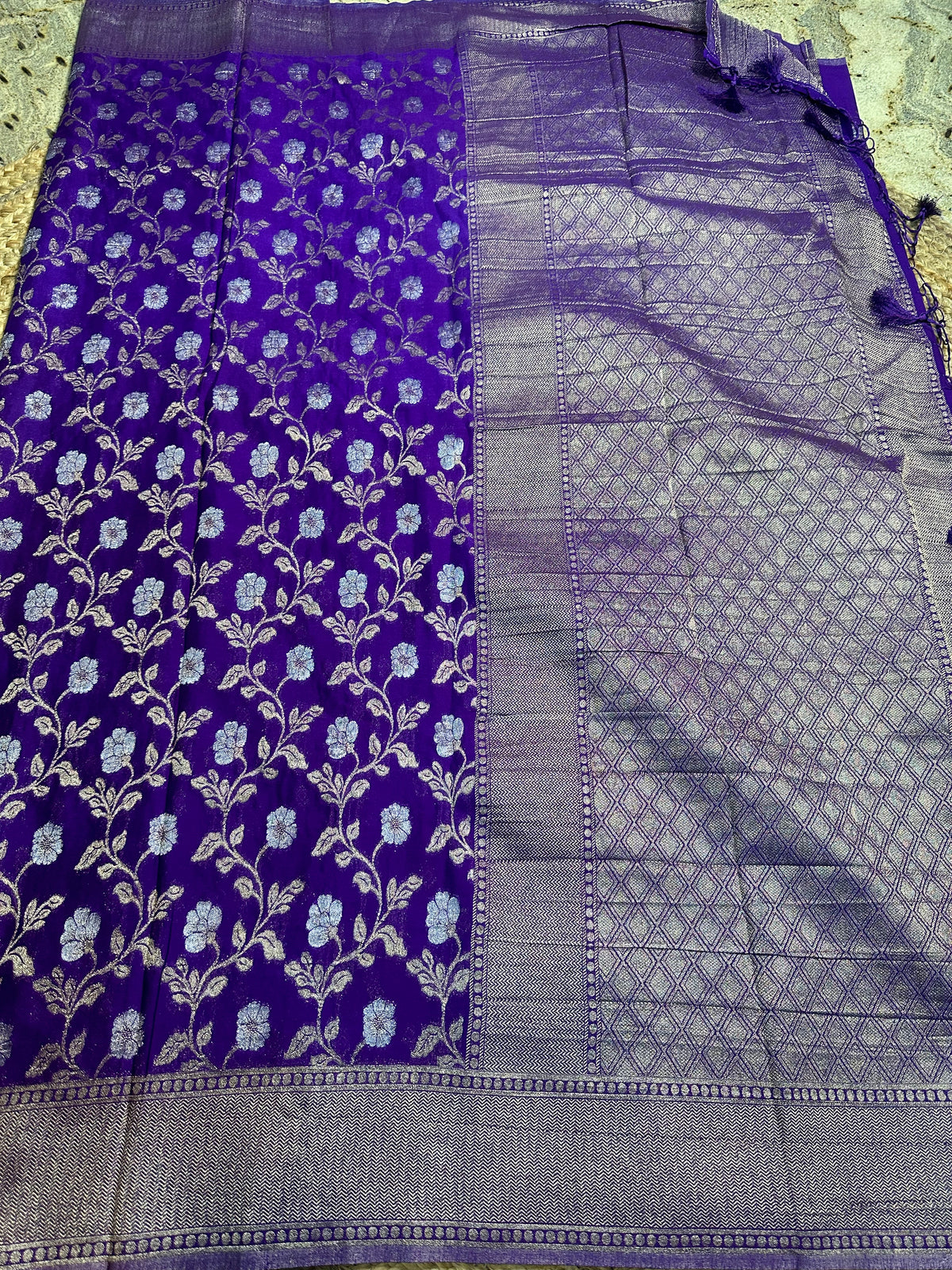 Purple designer georgette in jaal pattern saree.
