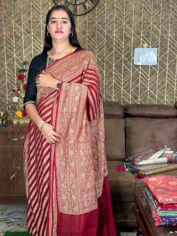 Maroon Pure khaddi Georgette saree with horizontal stripes.