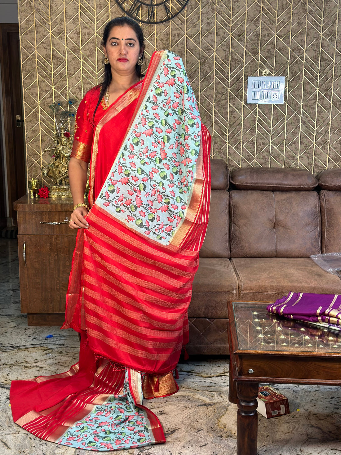 Semi Mysore Silk crepe. Red border with floral prints.