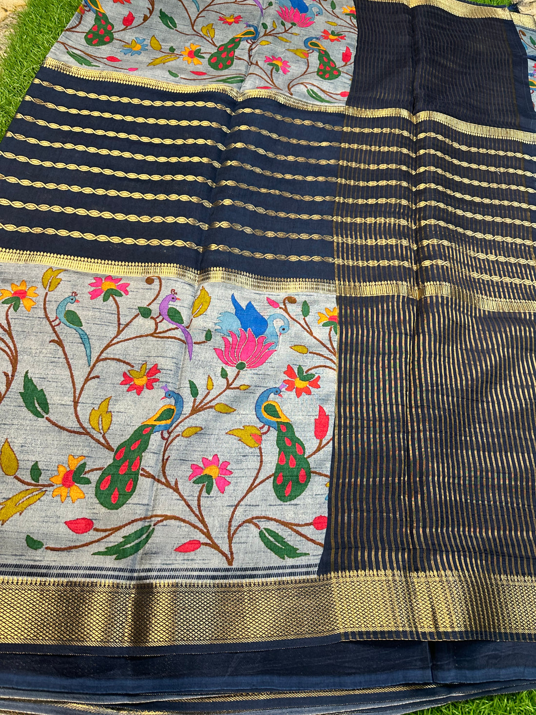 Grey and navy blue semi crepe kalamkari saree.